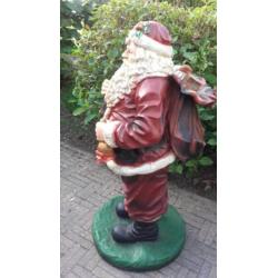 Mooie polyester kerstman 135 cm. hoog.